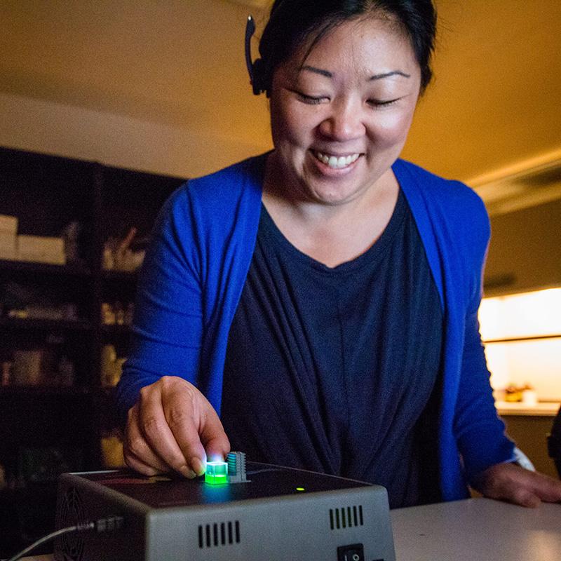 Elaine using the Fluorescence spectrometer