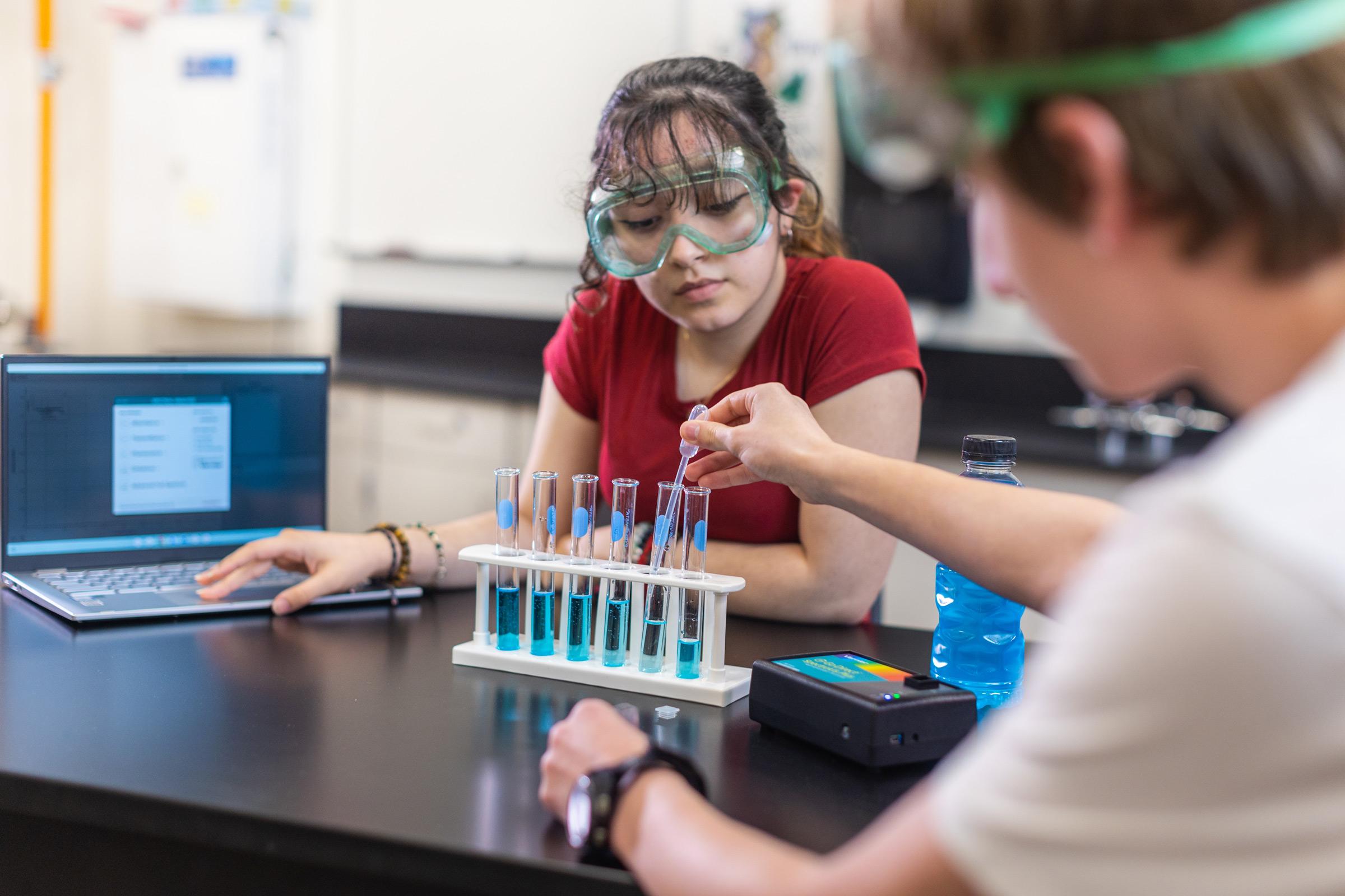 Students conduct an experiment with the Go Direct SpectroVis Plus spectrophotometer