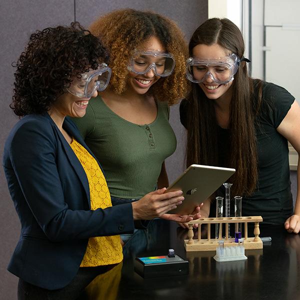 Chemistry high school teacher discussing spectroscopy with their students