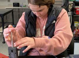 CTE Student using a Vernier Dual Range Force sensor to test meat tenderness. (Featured Image)