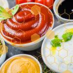 A variety of sauces in small bowls