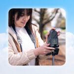 illustration of graphic clouds around a student using the Go Direct Air Quality sensor near the side of a road.