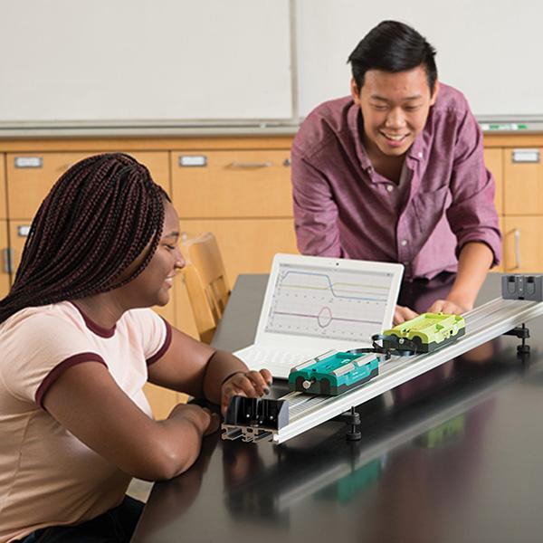 Students investigate kinematics with Go Direct Sensor Carts on a track.