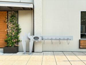 The bike rack at the front of the office is in the shape of a Vernier caliper.